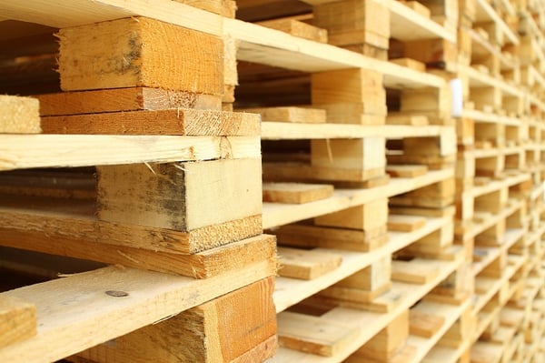 Stack of wooden pallets in warehouse